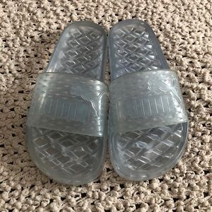 light blue puma slides